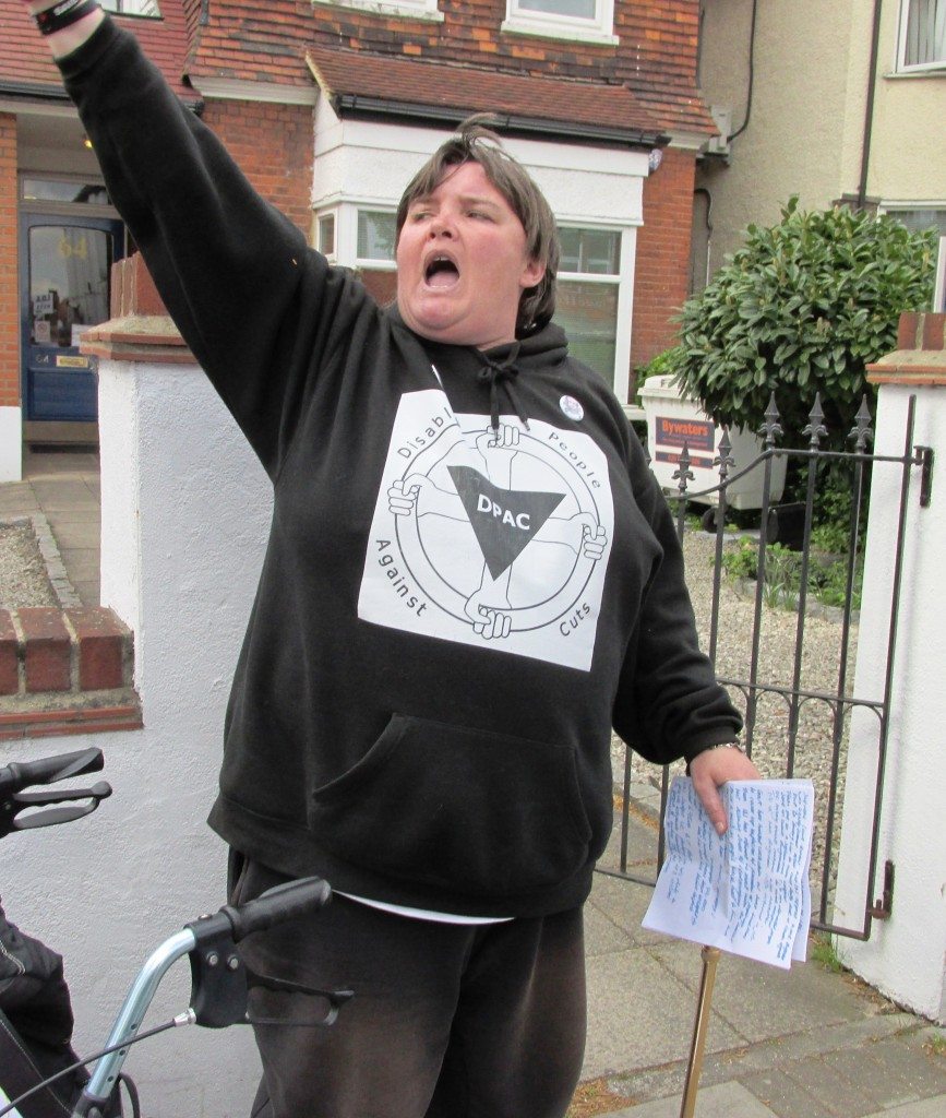 Paula Peters (DPAC) speaking outside Chingford IDS constituency office  