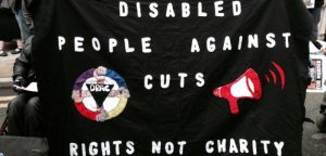 DPAC banner which says Disabled People Against Cuts: Rights not Charity