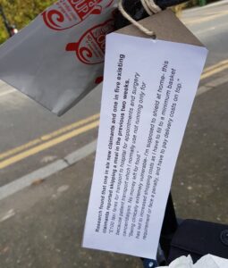 An empty Cuppa Soup pack on the arm of a wheelchair