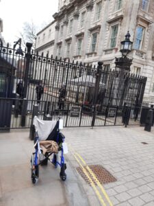 An empty wheelchair outside the gates to Downing St